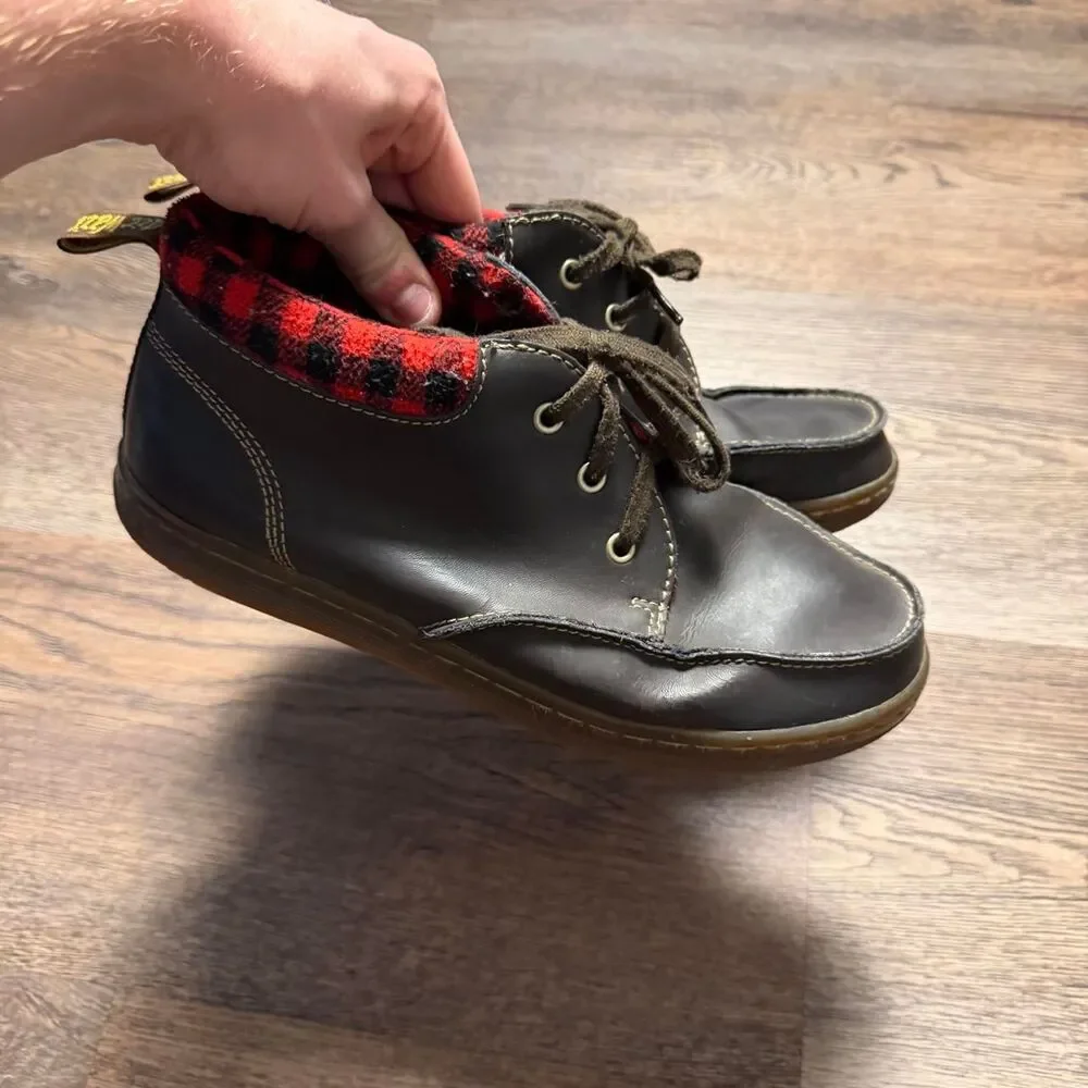 Dr. Martens black leather lace up boots with red/black plaid lining, size US 10